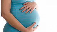 Conception and Maternity Reflexology. Pregnant tummy